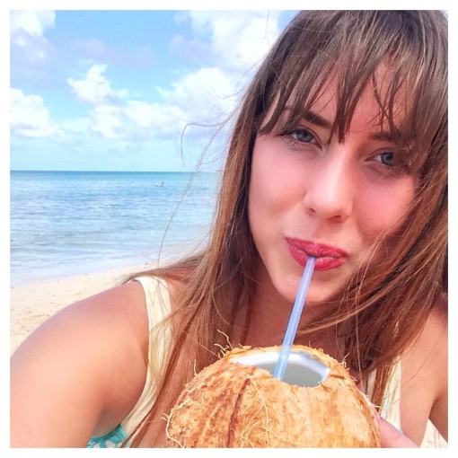 Drinking young coconut water on the beach